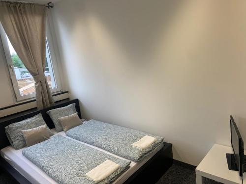 Ένα ή περισσότερα κρεβάτια σε δωμάτιο στο Veni Apartments