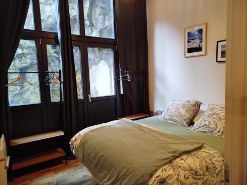 En eller flere senge i et værelse på Appartement 4 chambres avec terrasse