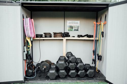 a smallshed with a bunch of equipment in it at ECOTurisme Can Buch HOTEL in Sant Aniol de Finestras