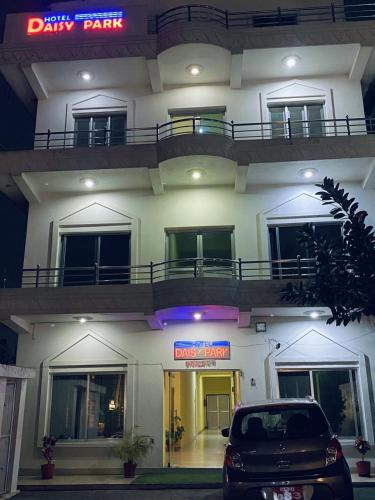 a car parked in front of a building at night at Hotel Daisy Park in Bhairāhawā