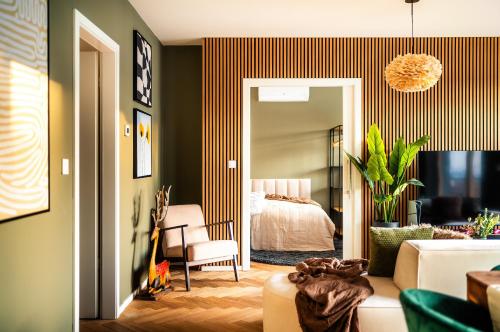 a living room with a bed and a couch at Wenceslas sq SOHO Boutique Hotel & Premium Suites in Prague