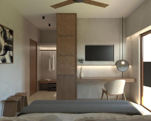 アギオス・ニコラオスにあるCasa Elounda - Adults only Hotel "by Checkin"のベッドと壁にテレビが掛かった寝室