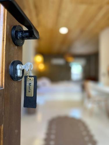 a lock on a door with a tag on it at Paleos İmroz in Gökçeada