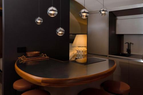 a dining room with a table and a mirror at CadensPlace - Overlooking Piazza Navona by dbalconycollection in Rome