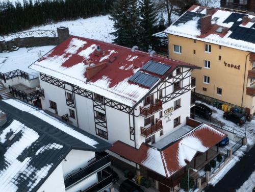 an aerial view of a building in the snow at Coco Boutique Hotel & Spa in Karpacz
