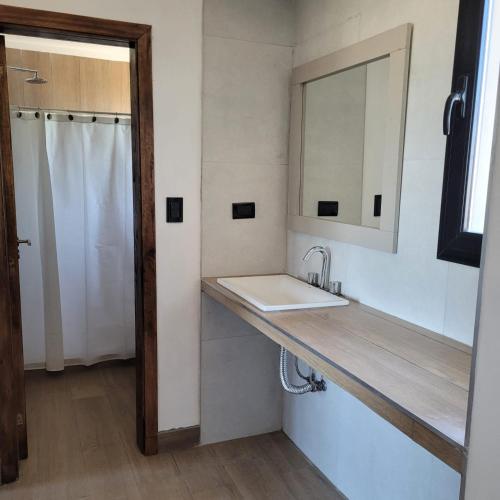 a bathroom with a sink and a mirror at Duplex a estrenar!! Zona Parque in Necochea