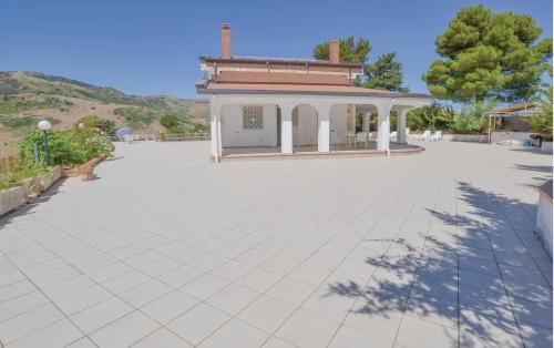 a large parking lot with a building in the background at Charming Villa in Monreale with Private Pool in Pioppo