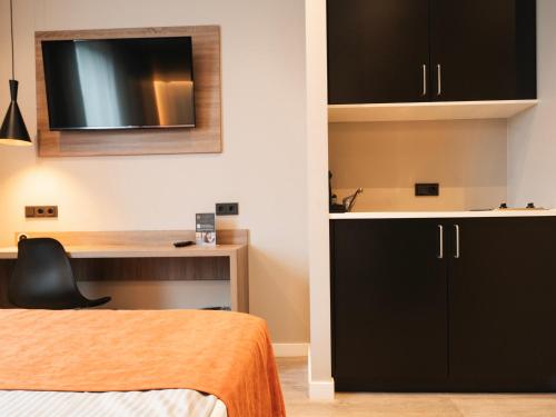 Ένα ή περισσότερα κρεβάτια σε δωμάτιο στο JustStay Grevenbroich Hotel & Apartments