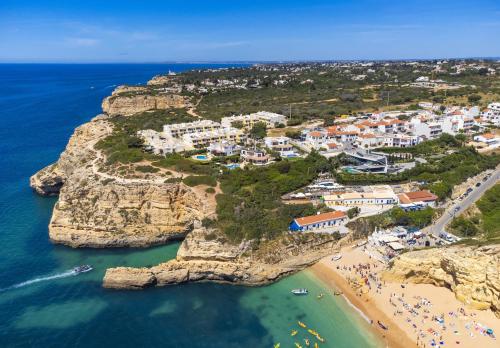 an aerial view of a village on a rocky coast at 30 Terracos de Benagil - Casa Domingos in Benagil