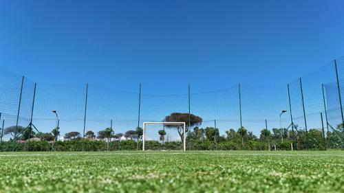 a soccer field with a net and a goal at Camping Village Roma Capitol in Ostia Antica
