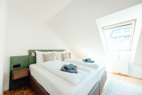 Cama o camas de una habitación en GH Luxury Apartments Graz, Gösser Haus