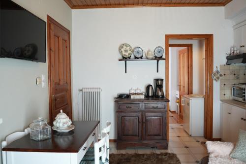 a kitchen with a wooden cabinet in a room at Boutique Arachova Retreat - Peaceful Mountain View in Arachova