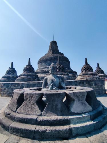 a statue in front of a building at Rumah Kalpataru in Yogyakarta