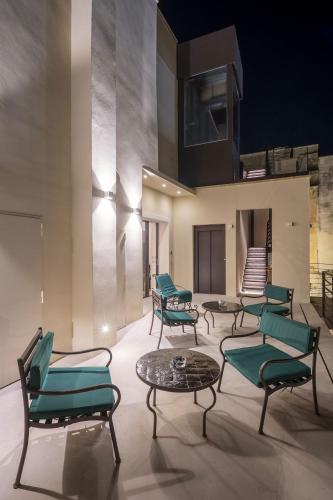 a group of chairs and tables in a room at Fiermonte Museum by La Fiermontina in Lecce