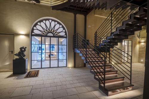 an entrance to a building with a spiral staircase at Fiermonte Museum by La Fiermontina in Lecce