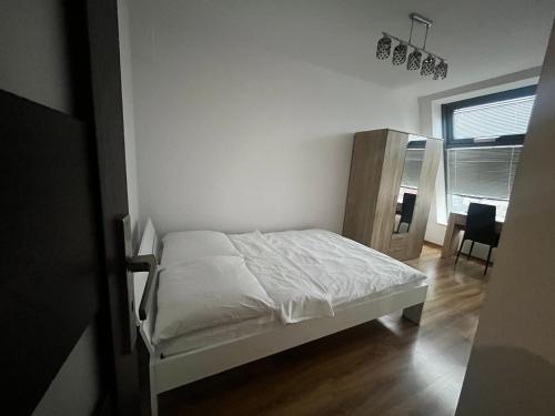 Posteľ alebo postele v izbe v ubytovaní Młynowa - Apartamenty Centrum New
