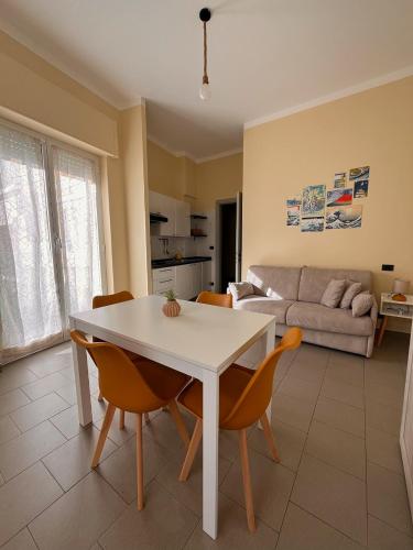 a living room with a white table and chairs at Residence Rodi in Alassio