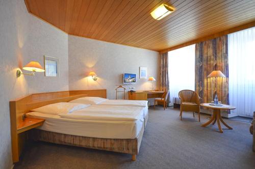 Postel nebo postele na pokoji v ubytování Hotel Felsenkeller