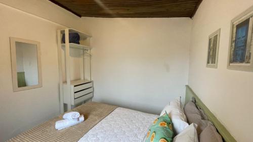 Ένα ή περισσότερα κρεβάτια σε δωμάτιο στο Casa Jabuticabeira