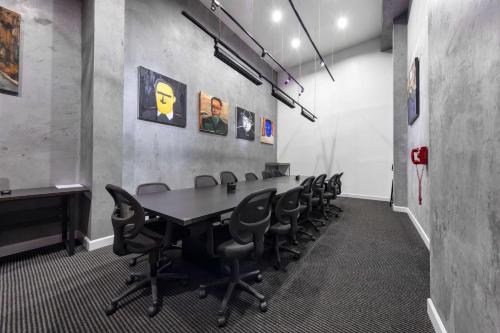 a conference room with a table and chairs at The O Hotel, Trademark Collection by Wyndham in Los Angeles