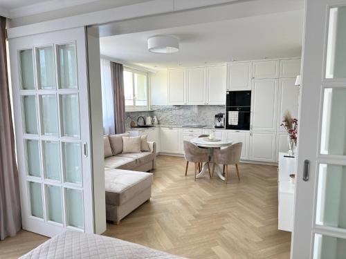 a living room with a couch and a table at Apartament Premium Sobieskiego in Tczew