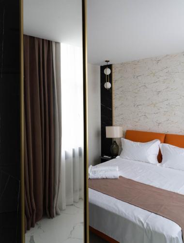 Ένα ή περισσότερα κρεβάτια σε δωμάτιο στο Design Hotel "Mamu Apartment" with kitchen and mountain views