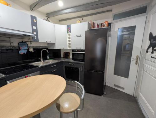 Køkken eller tekøkken på Le nid des voyageurs, Maison de vacances familiale