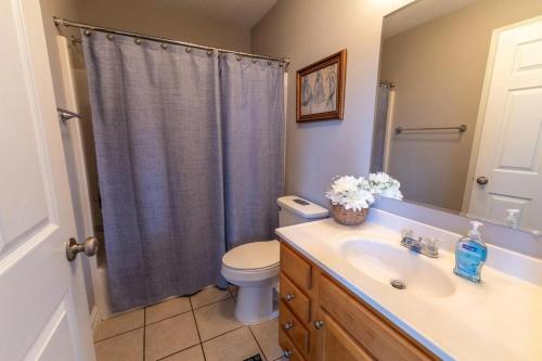 a bathroom with a sink and a toilet and a shower at Harborview at Lake Cumberland in Somerset