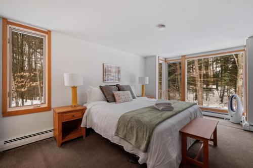 Ένα ή περισσότερα κρεβάτια σε δωμάτιο στο Classic Stratton Ski Chalet