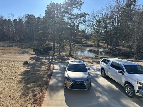 two cars parked next to each other on a road at The Bandit Suite in Lexington