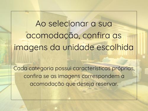 a sign in a glass window of a room at Caminho das Pedras Pousada de Charme in Campos do Jordão