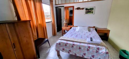 Ένα ή περισσότερα κρεβάτια σε δωμάτιο στο Hotel Pedregal