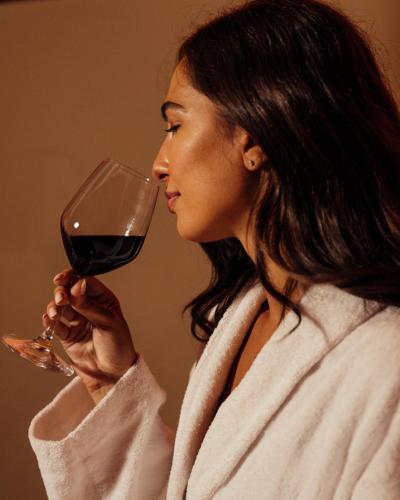 a woman drinking a glass of red wine at Grand Hotel Telese in Telese