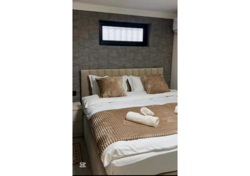 Ένα ή περισσότερα κρεβάτια σε δωμάτιο στο METROMIR Hotel