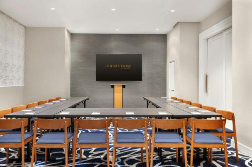 a large conference room with a large table and chairs at Courtyard by Marriott New York Manhattan/Chelsea in New York
