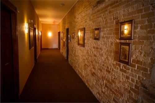 a hallway in a building with a brick wall at Nuk's Executive Suites in De Pere