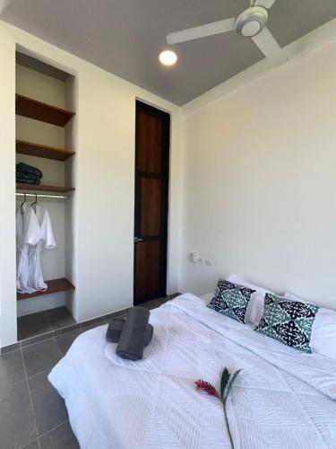 a bedroom with a bed with a speaker on it at Ecohab el paraíso in Barranca de Upía