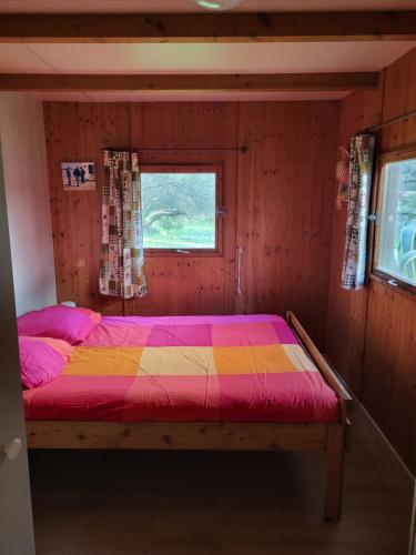 Ένα ή περισσότερα κρεβάτια σε δωμάτιο στο Chalet Cosy - U Nestru
