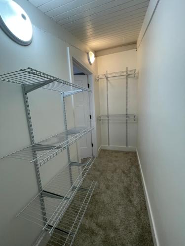 an empty room with shelves on the wall at Modern Getaway - New Outdoor Amenities! - Location in Osage Beach