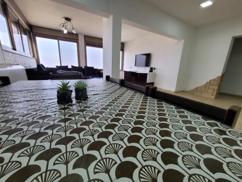 a large room with a floor with plants on it at Dream in Tiberias in Tiberias