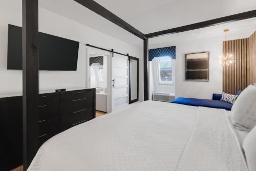 a bedroom with a large bed and a tv at Nassau Inn in Princeton