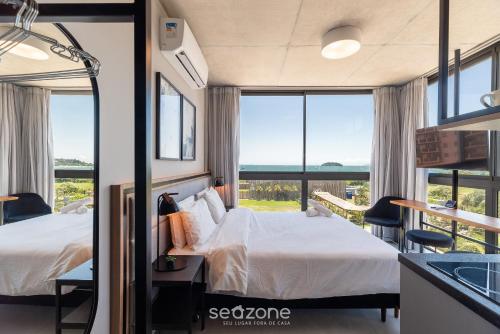 Cama o camas de una habitación en Spot Jurere sofisticación junto al mar - SPJ's