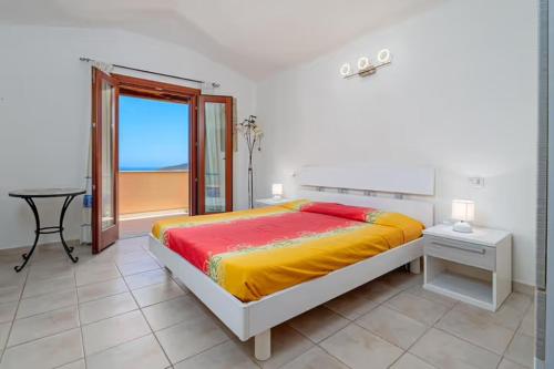 Ένα ή περισσότερα κρεβάτια σε δωμάτιο στο Villetta Lutturai