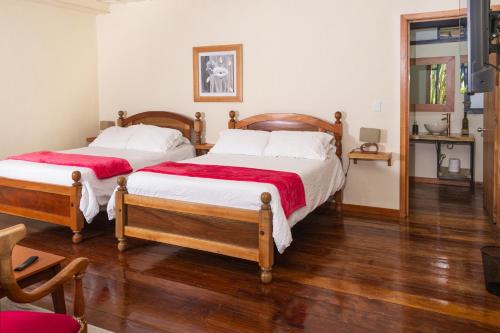 Postel nebo postele na pokoji v ubytování El Edén Country hotel y Club Residencial