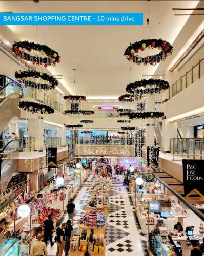 a shopping centre with people walking through a store at NEW Bangsar Trade Centre KL Mid Valley LRT Bangsar in Kuala Lumpur
