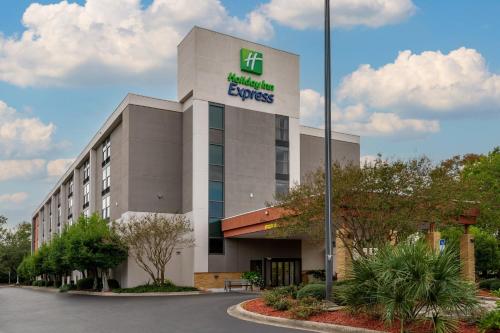 an office building with a hilton express sign on it at Holiday Inn Express Tallahassee by IHG in Tallahassee