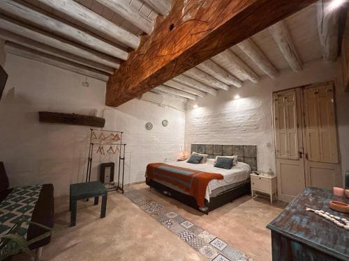 Postel nebo postele na pokoji v ubytování Posada Via Vento - Chacras de Coria