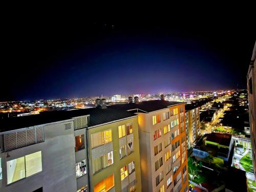 a view of a city at night with buildings at Apart VIP PIURA Aire Acondicionado-Estacionamiento in Piura