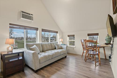 a living room with a couch and a table at Maple Leaf Manor Suites in Spokane