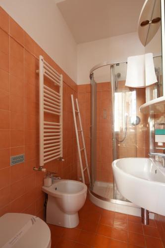 a bathroom with a sink and a toilet and a shower at Shanti 3 - Riomaggiore private room in Riomaggiore